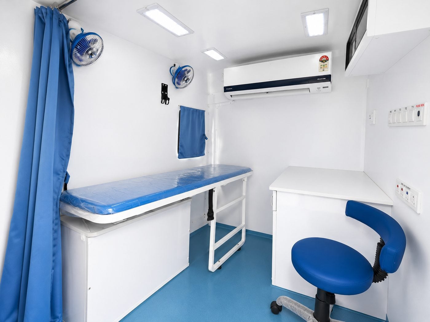 Inside a Clinics On Cloud Mobile Medical Unit - examination bed, air-conditioned cabin and consultation seat